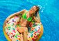 Summer Vacation. Enjoying suntan Woman in bikini on the inflatab