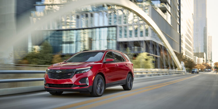 Front 3/4 view of 2024 Chevrolet Equinox RS in Radiant Red Tintcoat.