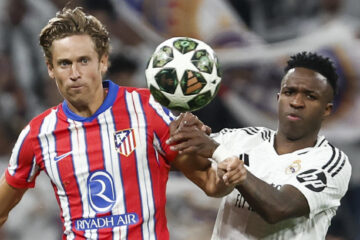 El centrocampista del Atlético de Madrid Marcos Llorente (i) y el delantero brasileño del Real Madrid Vinicius Junior en el estadio Santiago Bernabéu, en Madrid en foto de archivo de Sergio Pérez. EFE